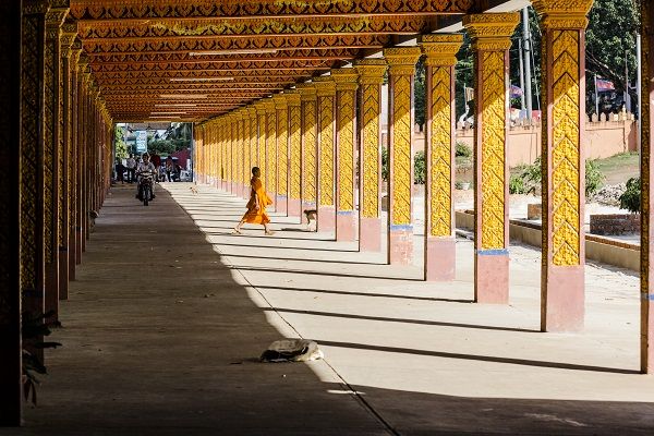 Motorcycle and monk in Cambodia