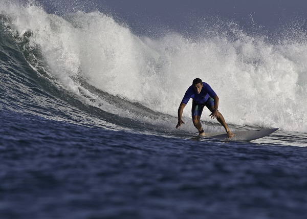 Surfer on Airport Rights, Bali, Indonesia.