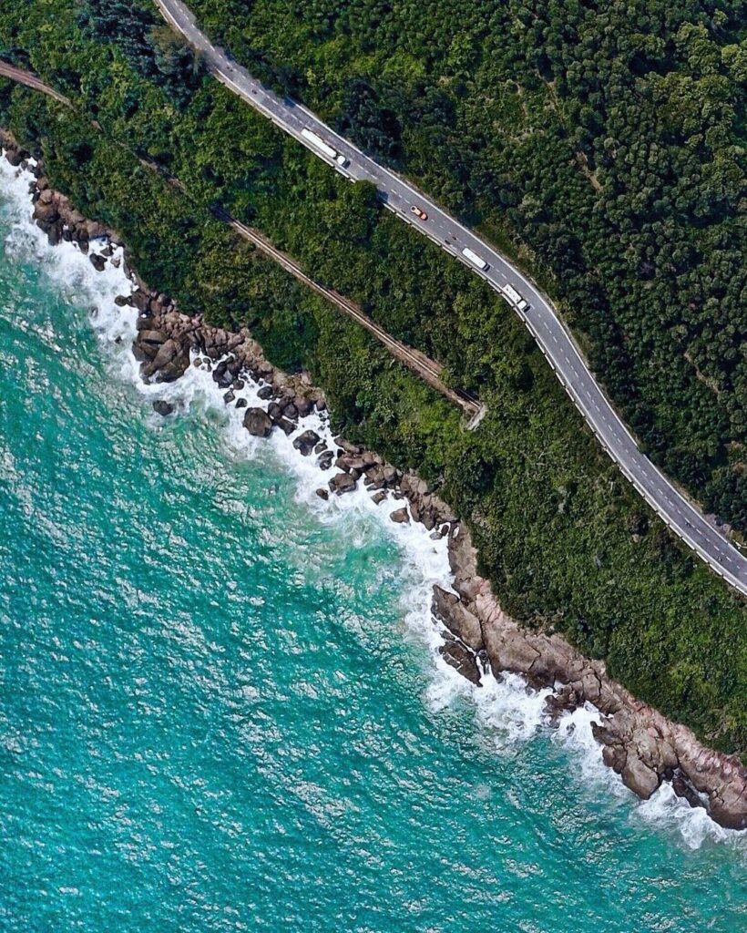 Across just over 12 miles is the Hai Van Pass, or the “Sea Clouds Pass,” a breathtaking road tracing Vietnam’s eastern coast and surrounded by towering mountains.